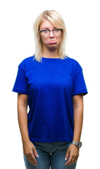 Fototapeta premium Young beautiful blonde woman wearing glasses over isolated background depressed and worry for distress, crying angry and afraid. Sad expression.