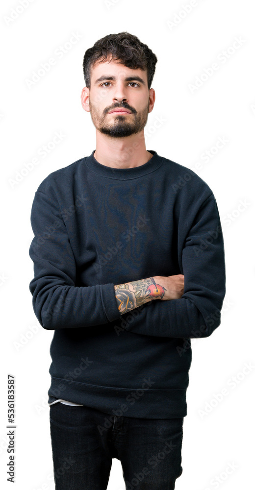 Sticker Young handsome man over isolated background Relaxed with serious expression on face. Simple and natural looking at the camera.