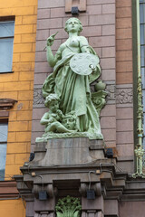 Fototapeta na wymiar Statues of Art in the facade of Elisseeff Emporium in St. Petersburg, Russia