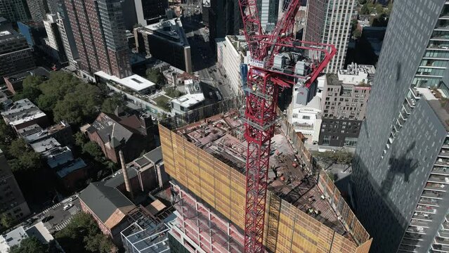 flying backward tilt up shot of skyscraper construction in Brooklyn NY