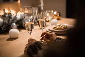 New Year concept, woman and man with champagne glasses clinking