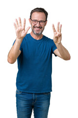 Fototapeta premium Handsome middle age hoary senior man wearin glasses over isolated background showing and pointing up with fingers number eight while smiling confident and happy.