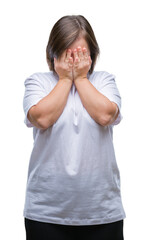 Young adult woman with down syndrome over isolated background with sad expression covering face with hands while crying. Depression concept.