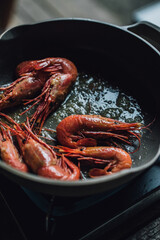 whole spot prawns in frying pan with butter