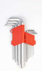 Close up of a set of hex keys in a red box. A set of hand tools for steel bolts of various sizes.