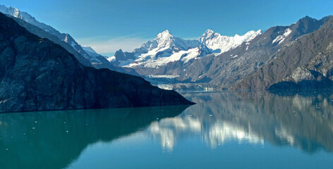 Fototapeta na wymiar View of Glacier Bay National Park from the stern of a cruise ship - Just 250 ears ago this bay was all ice and extended 100 miles long and thousands of feet deep.