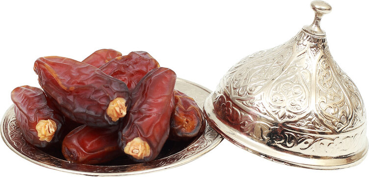 Islamic festival of Ramadan concept. with a delicious tropical dates on a silver plate and on white isolated background. Traditional Middle East culture. Ramadan Kareem transparent png image
