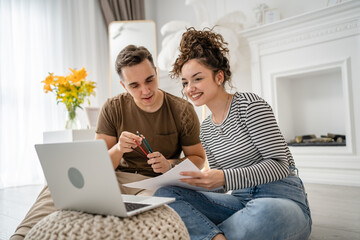 young couple man and woman having online class learn to draw on laptop