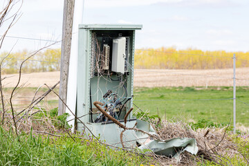 Telephone pedestal box damage with broken wires. Telephone outage, repair and maintenance concept