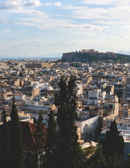 Athens, Attica, beautiful super-wide angle view of Athens, Greece, with Acropolis, Mount Lycabettus, mountains and scenery beyond the city, seen from Strefi Hill park in Exarcheia neighbourhood