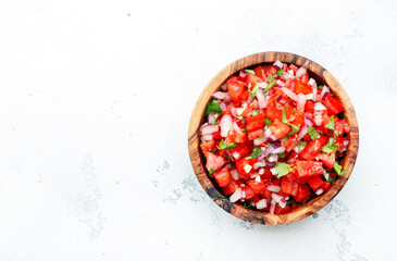 Mexican food. Spicy salsa sauce with tomatoes, chili peppers, onion, garlic and cilantro, white...