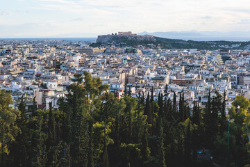 Athens, Attica, beautiful super-wide angle view of Athens, Greece, with Acropolis, Mount Lycabettus, mountains and scenery beyond the city, seen from Strefi Hill park in Exarcheia neighbourhood