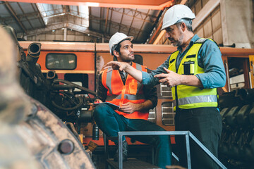 professional technician engineer working to control electrical power and safety service system,...