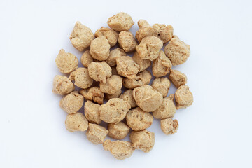 Textured soy protein on white background.