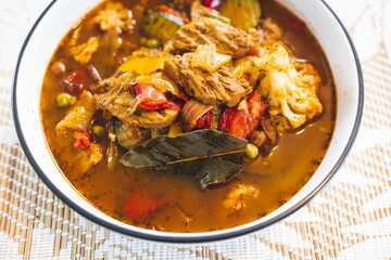 healthy plant-based food, vegan turkish hotpot with Mediterranean vegetables and vegan meat chunks in spicy broth