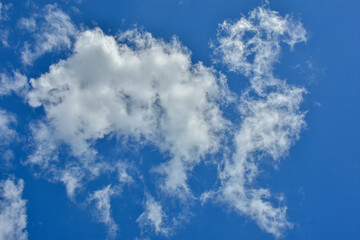 White clouds against blue sky for a backgrounds