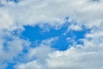 White clouds against blue sky for a backgrounds