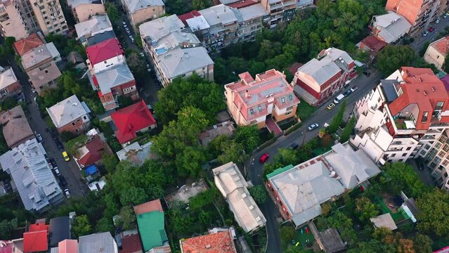 Panoramic view of Tbilisi residential district over the Vake residential quarter at dawn. Aerial drone video with the backward camera motion