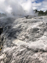 Rotorua geothermal hot spring geyser erupting and thermal mud pools., North Island, New Zealand