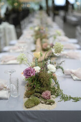 Flowers decoration for wedding or fine dinning table in private party. Family intimacy dinner night outdoors with clear tent