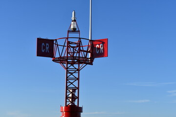 coast guard buoy on clear blue sky