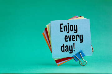 Enjoy every day written on a memo at the office
