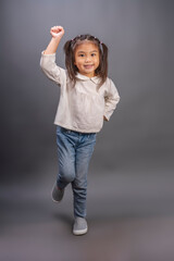 Happy girl wearing white shirt on gray background, smartkid nice-looking attractive lovely sweet curious cheerful cheery girl wearing white shirt with happy moment.