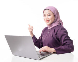 Young beautiful Asian Islamic businesswoman wearing hijab holding a tablet computer. Women empowerment and leadership concept. Isolated on white background