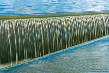 Water flowing in ditch inlet. Weir water stripes pattern,use for background and texture. - 536218736