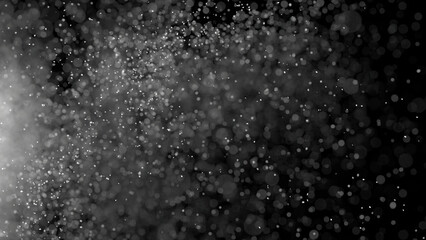 3D rendering of dust particles with bokeh on black background.