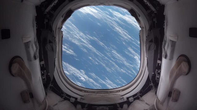 A view from the window of a spaceship escape pod looking down on the surface of planet earth from space