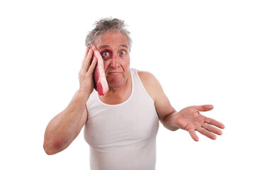 Man with an bruised black eye putting steak on his face to reduce swellling