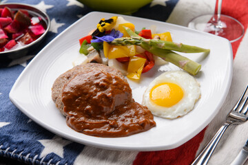 Fried eggs and hamburger steak