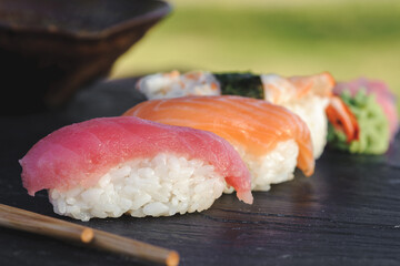 Japanese sushi on black stone outdoor