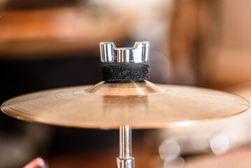 A vintage crash cymbal showing the felt washer that holds it in place.