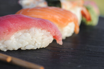 Japanese sushi on black stone outdoor