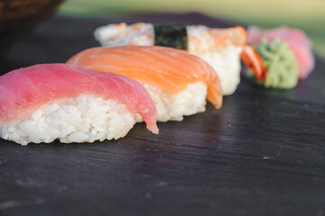 Japanese sushi on black stone outdoor