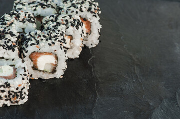 Japanese sushi roll philadelphia on black stone