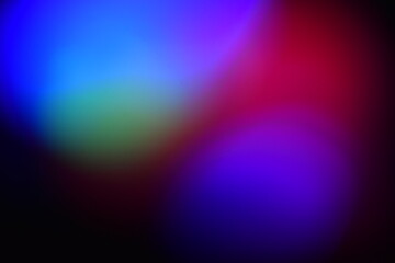 Multicolored round blurry spots garland on black background