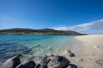 Clear water and golden sand at Hushinish beach on the Isle of Harris in Scotland on a sunny day