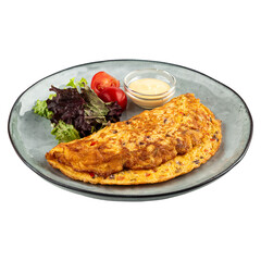 Portion of omelette with salad and sauce