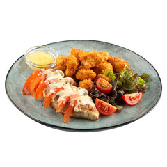 Portion of stuffed chicken fillet with battered cauliflower