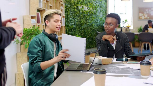 Startup meeting, creative planning team and idea sharing for business project. Strategy, presentation and diversity, men and women in modern office for collaboration, teamwork or advertising workshop