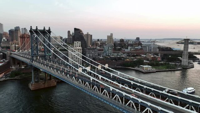 helicopter flying over East River Manhattan Bridge and skyline sunset New York City NYC