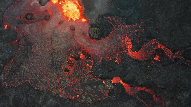 Active vulcano erupting lava and magma in Iceland, Fagradalsfjall 2022. Areal top down moving.