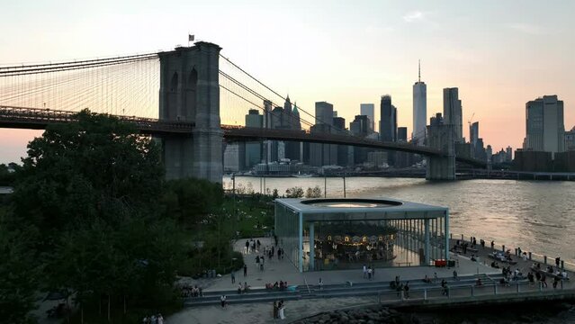 sunset Janes Carousel Brooklyn Bridge Park on water East River Manhattan skyline New York City NYC
