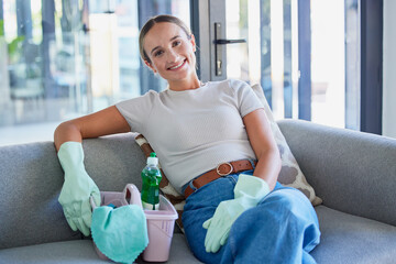 Sofa, cleaning service and business woman in portrait with cleaner product basket and house living...