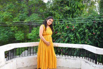 Six months Pregnant Indian Woman with nature background