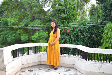 Six months Pregnant Indian Woman with nature background