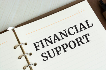 Word text Financial Support on white paper